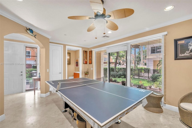 rec room featuring ornamental molding, a healthy amount of sunlight, and ceiling fan