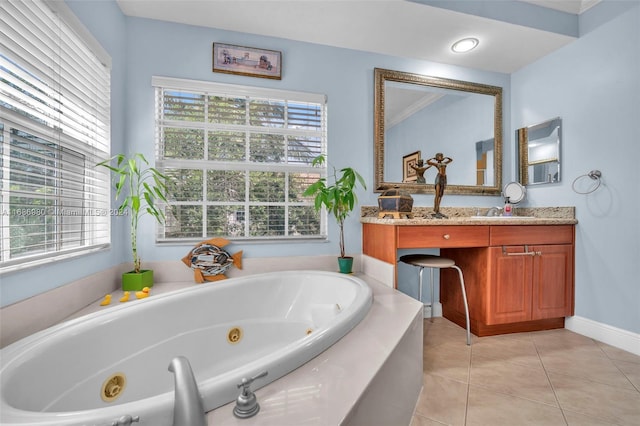 bathroom with vanity, ornamental molding, a bath, and tile patterned flooring