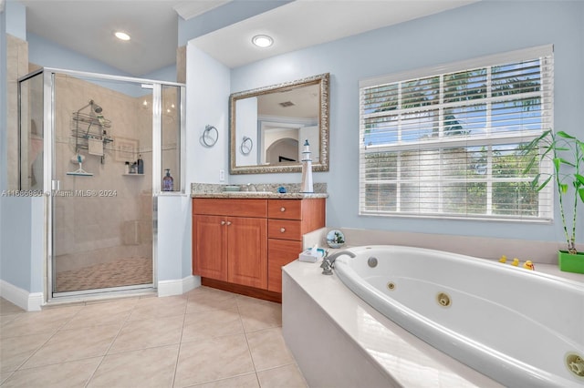 bathroom with vanity, independent shower and bath, and tile patterned flooring