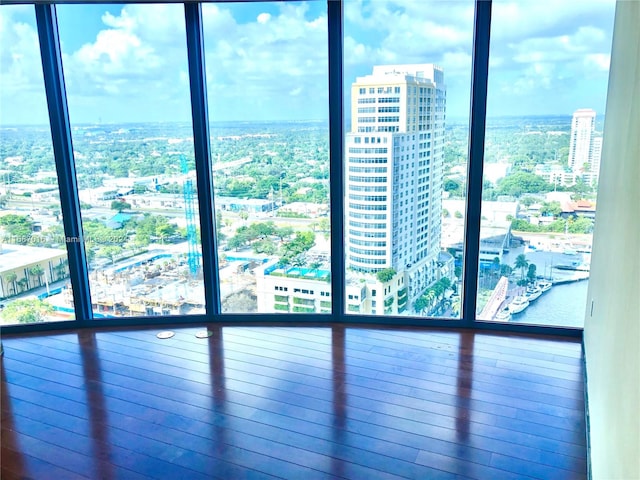 unfurnished room featuring a water view