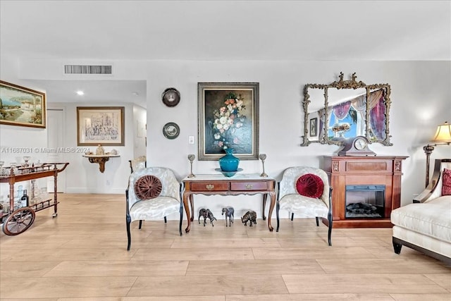 sitting room with light wood-type flooring