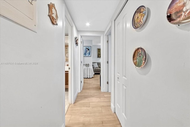 corridor with light wood-type flooring