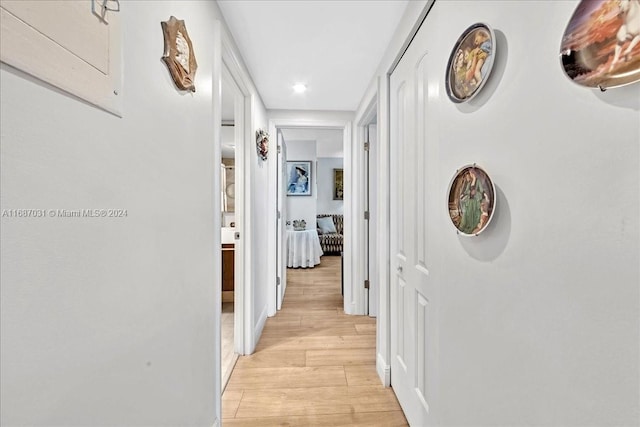 hall with light hardwood / wood-style floors