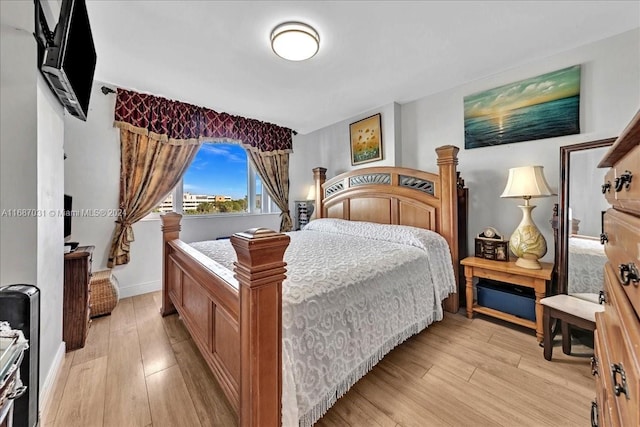 bedroom with light hardwood / wood-style flooring