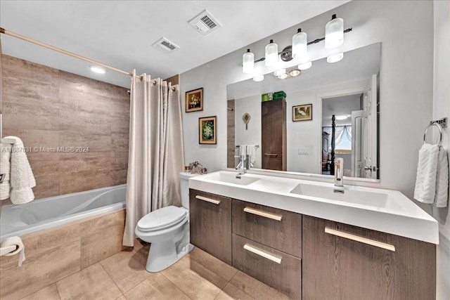 full bathroom with vanity, shower / tub combo, toilet, and tile patterned floors