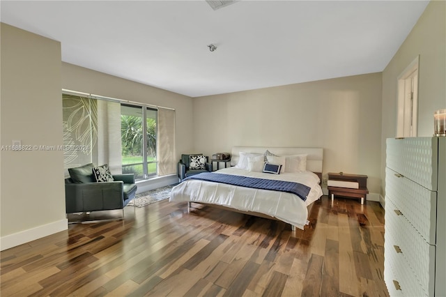 bedroom featuring hardwood / wood-style floors