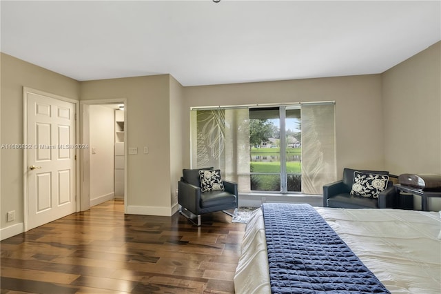 bedroom with dark hardwood / wood-style floors