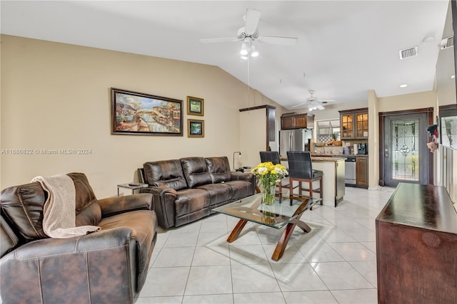 tiled living room with lofted ceiling and ceiling fan