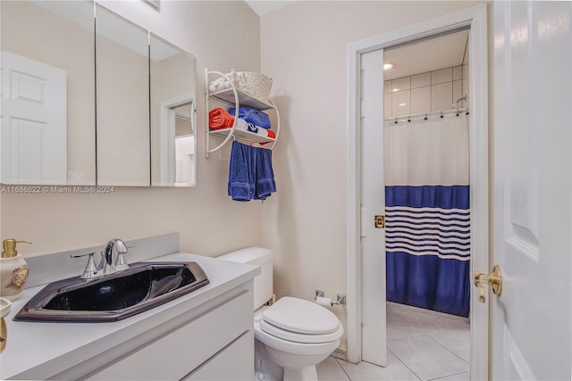 bathroom featuring vanity, tile patterned floors, toilet, and a shower with curtain