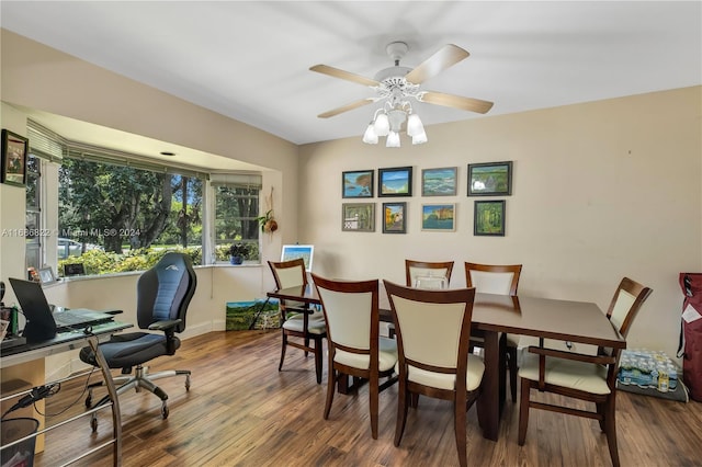 dining space featuring hardwood / wood-style flooring and ceiling fan