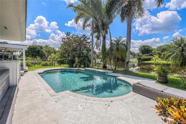 view of pool featuring a patio and a water view