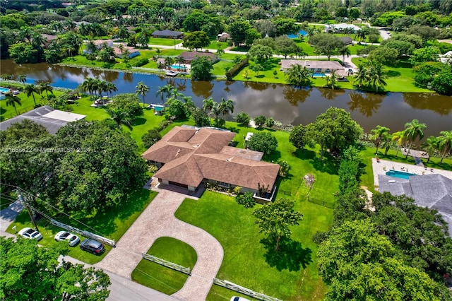 birds eye view of property with a water view