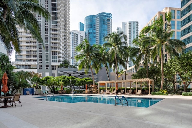 view of swimming pool with a pergola and a patio