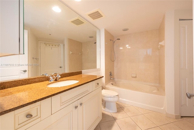 full bathroom with tile patterned floors, vanity, toilet, and tiled shower / bath