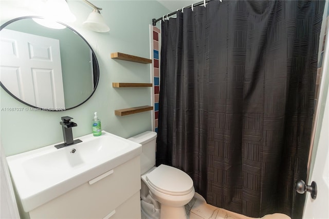 bathroom with vanity, toilet, and a shower with curtain