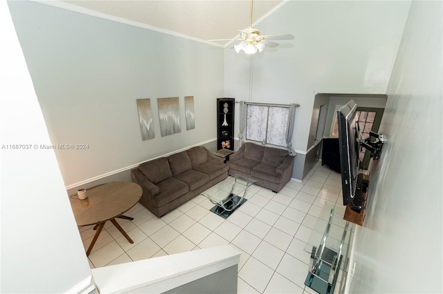 living room featuring crown molding, ceiling fan, and light tile patterned floors