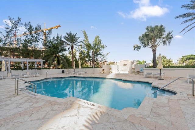 view of pool featuring a pergola and a patio