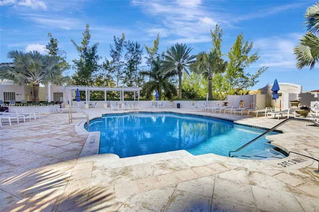 view of swimming pool featuring a pergola and a patio area