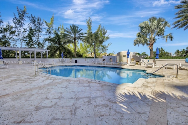 view of pool with a pergola and a patio area