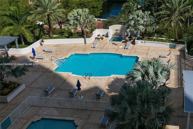 view of pool featuring a pergola and a patio