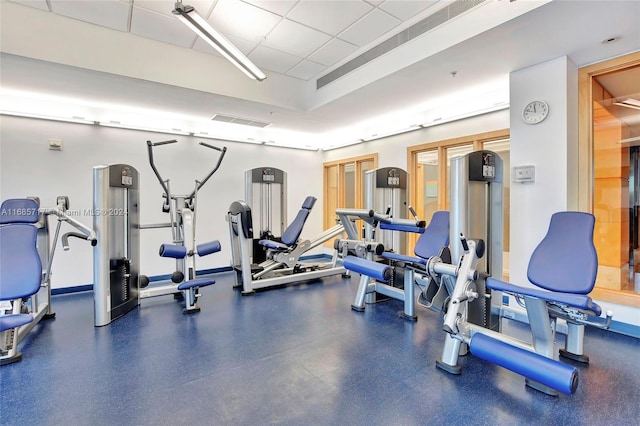 gym featuring a paneled ceiling