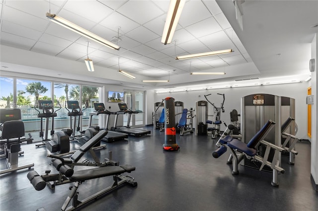 exercise room with a paneled ceiling