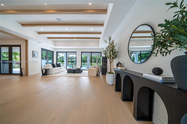 interior space with french doors, a wealth of natural light, and light wood-type flooring