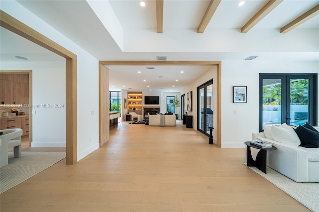 hallway featuring light hardwood / wood-style floors and french doors