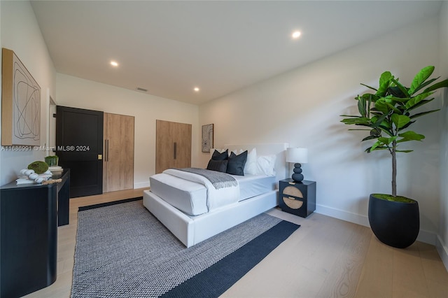 bedroom featuring light hardwood / wood-style flooring