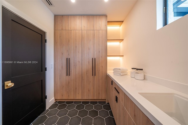 bathroom featuring vanity and tile patterned floors