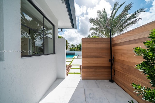 view of patio / terrace featuring a swimming pool