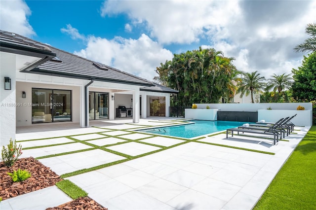 view of pool with outdoor lounge area and a patio area