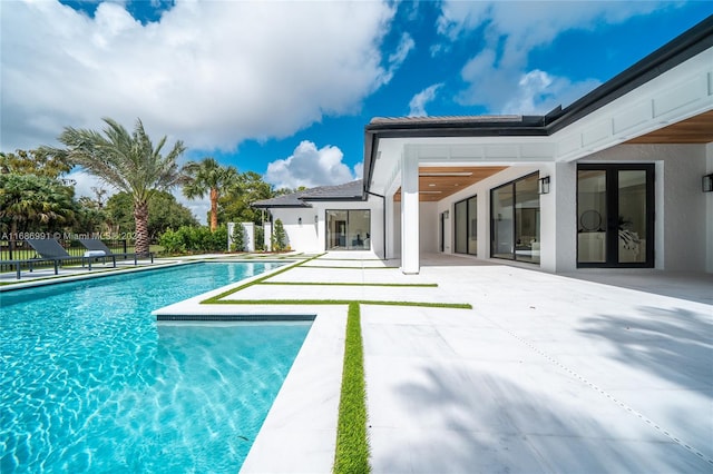 view of swimming pool featuring a patio area