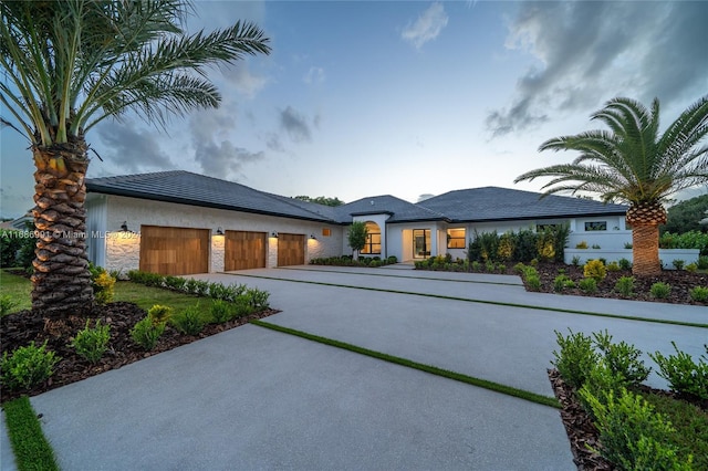 view of front of property with a garage