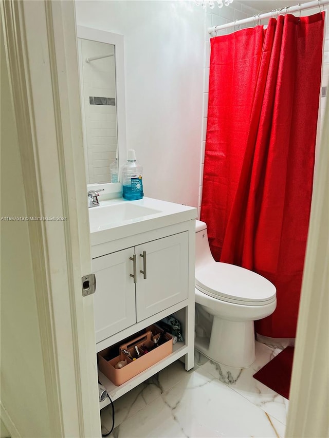 bathroom featuring vanity, curtained shower, and toilet