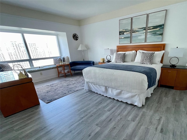 bedroom with wood-type flooring