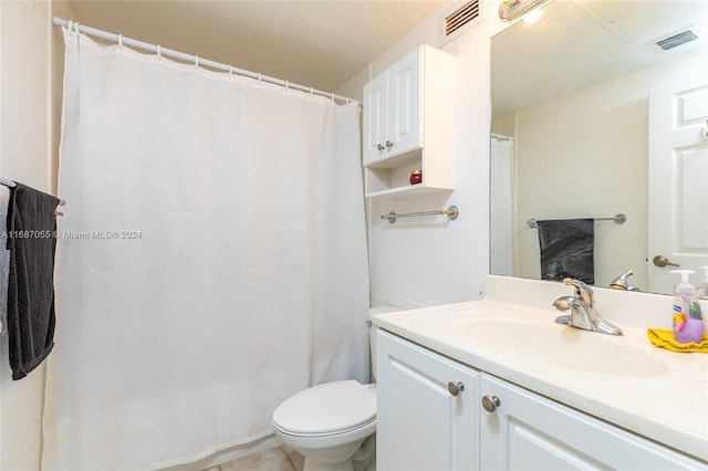 bathroom with vanity, a shower with curtain, toilet, and tile patterned flooring