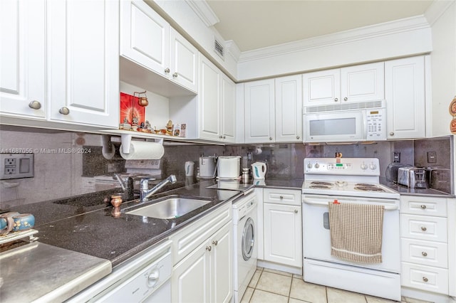 kitchen with ornamental molding, washer / clothes dryer, sink, and white appliances