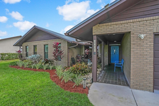 property entrance with a yard