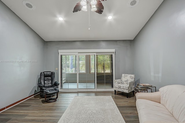 sitting room with ceiling fan and hardwood / wood-style flooring