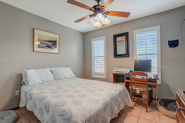 tiled bedroom featuring ceiling fan