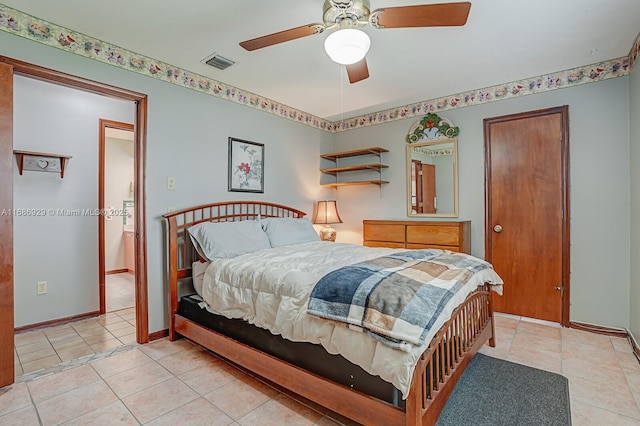 tiled bedroom featuring ceiling fan