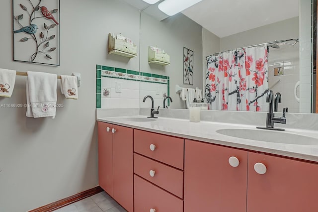 bathroom featuring vanity and curtained shower