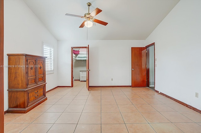 tiled bedroom featuring ceiling fan and vaulted ceiling