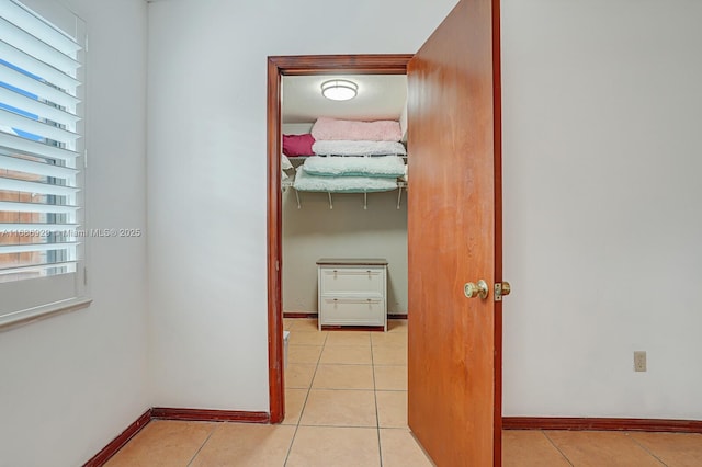 hall with light tile patterned flooring