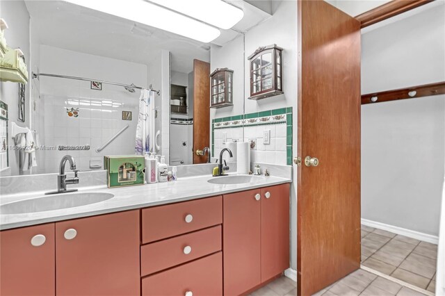 4706 SE Manatee Ter, Stuart, FL 34997 - full bathroom featuring a shower with curtain, tile patterned floors, and double vanity