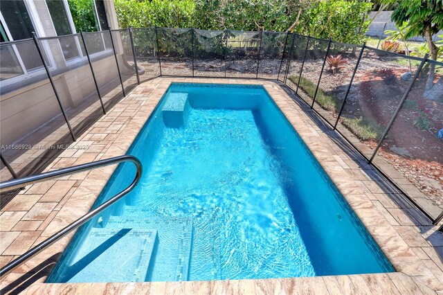 4706 SE Manatee Ter, Stuart, FL 34997 - view of swimming pool with fence