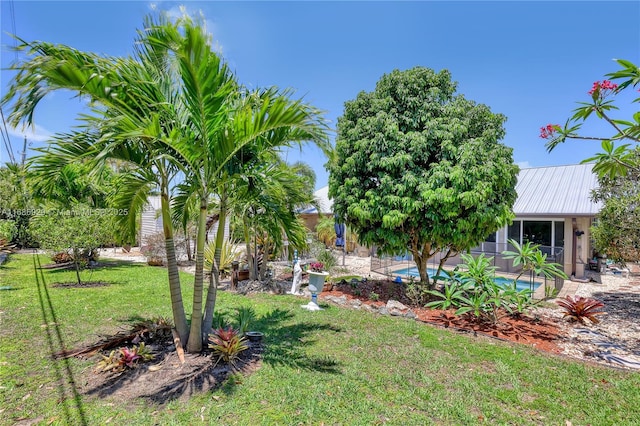 4706 SE Manatee Ter, Stuart, FL 34997 - view of green lawn featuring an outdoor pool