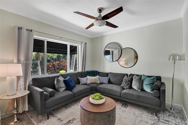 living room with a wall mounted AC and ceiling fan