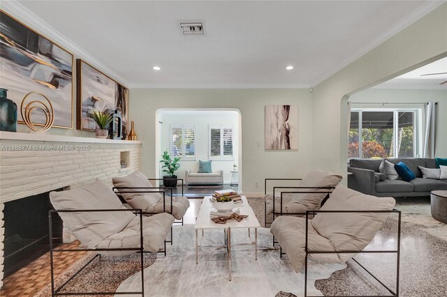 dining area with crown molding and ceiling fan